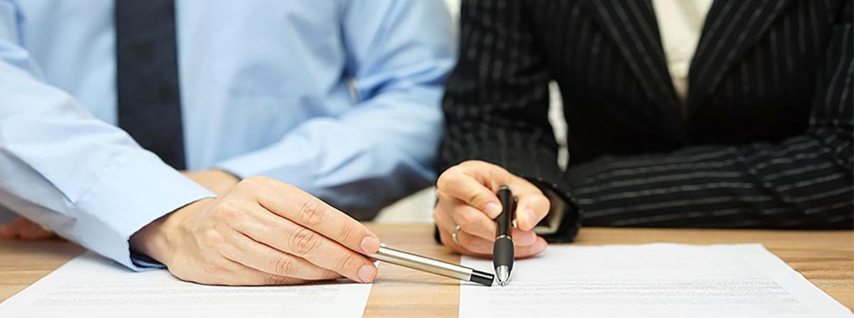 Man Pointing to Where to Sign