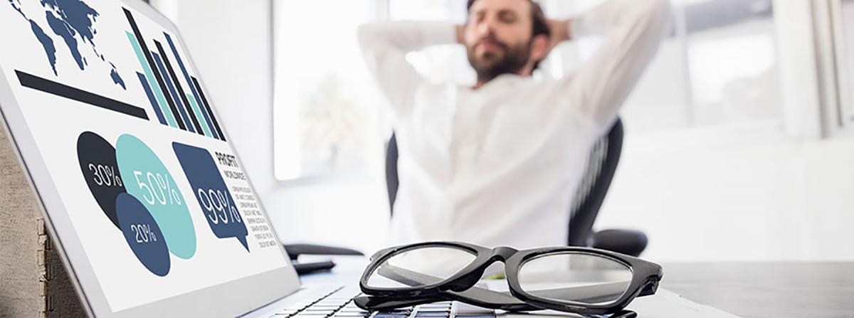 Man relaxing because efficiency of his multifunction printers